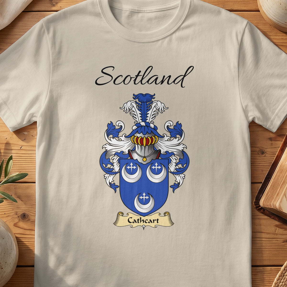 Sand Cathcart Scottish family shield T-shirt featuring three white crescents and small crosses on blue
