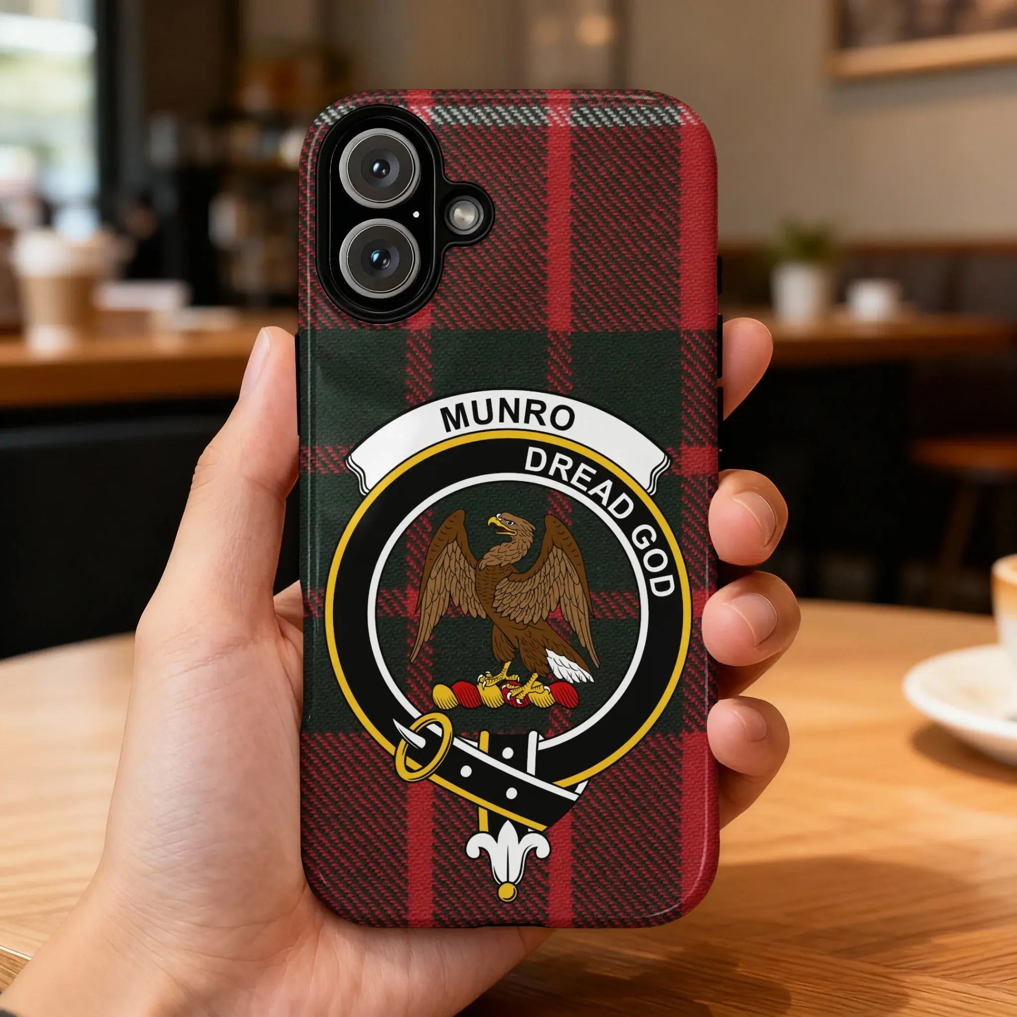 Clan Munro Dread God eagle crest tartan phone case — glossy full-wrap print on iPhone