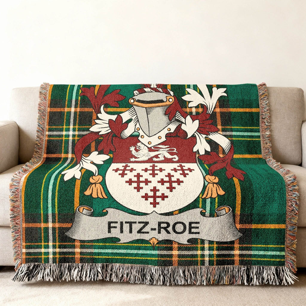 Fitz-Roe family crest on a green plaid woven throw blanket.