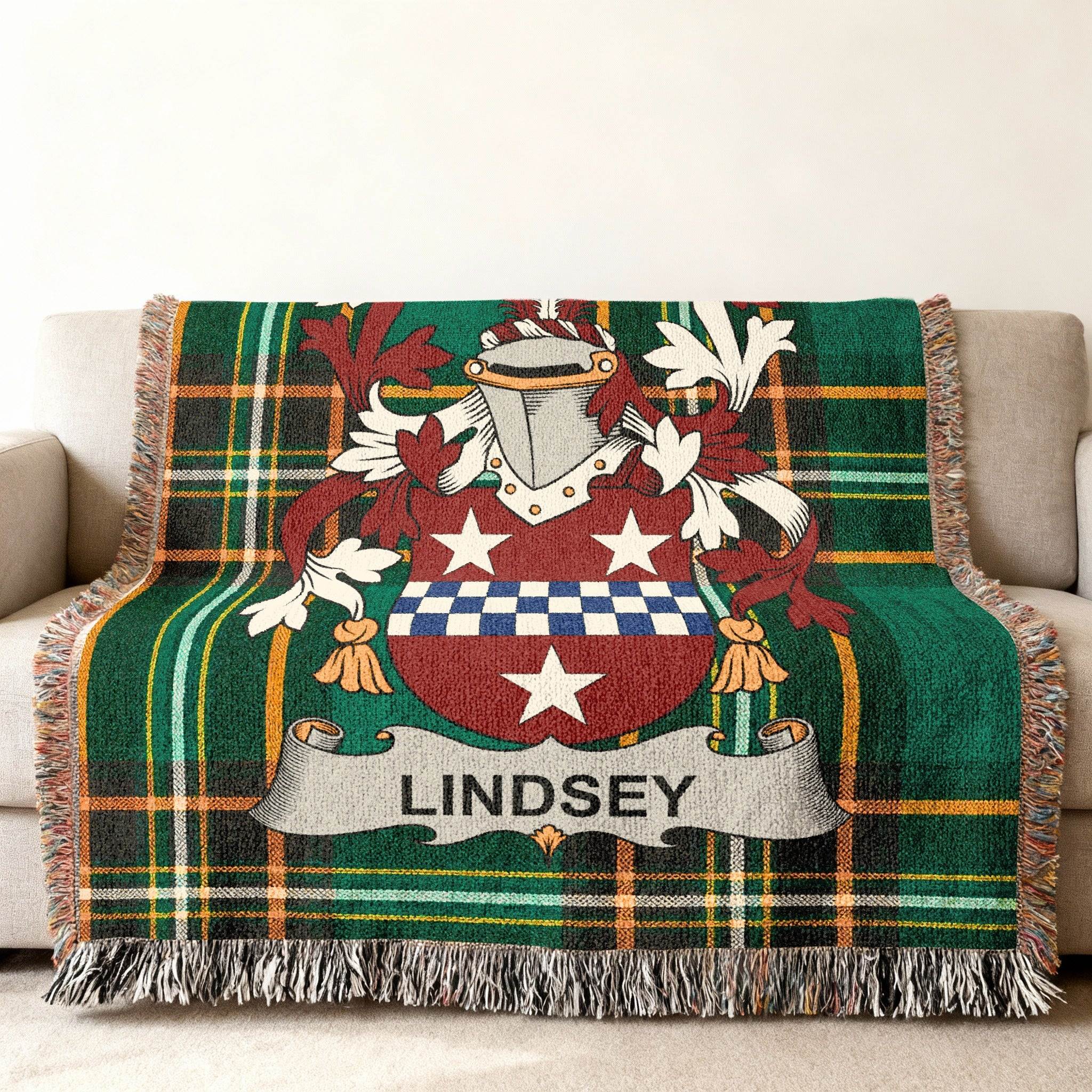 Tartan blanket with Lindsey family crest on a couch.