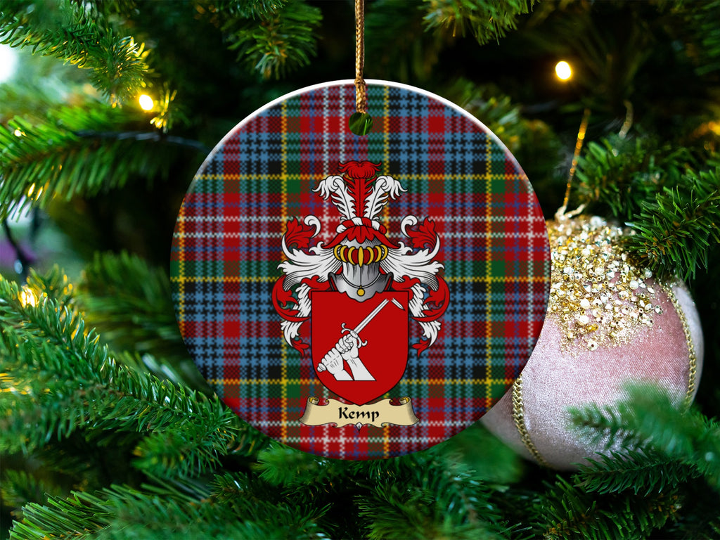 Kemp Scottish clan ceramic ornament with family crest on a Caledonia tartan background, hanging on a Christmas tree