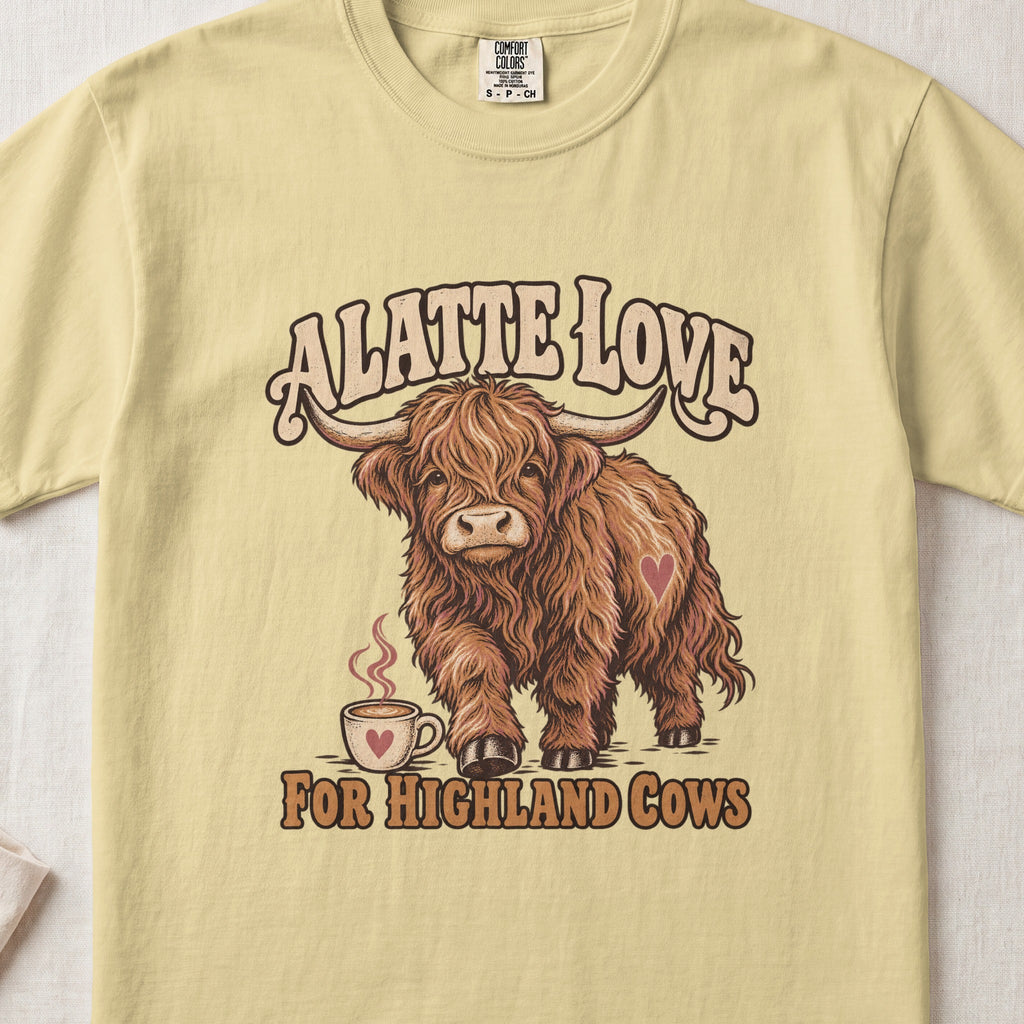 A Latte Love for Highland Cows Highland cow design on a Butter Comfort Colors 1717 T-shirt, flat lay