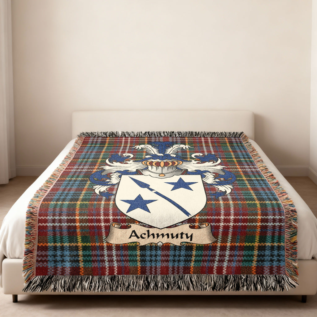 Achmuty family crest emblem on a Caledonia tartan woven blanket