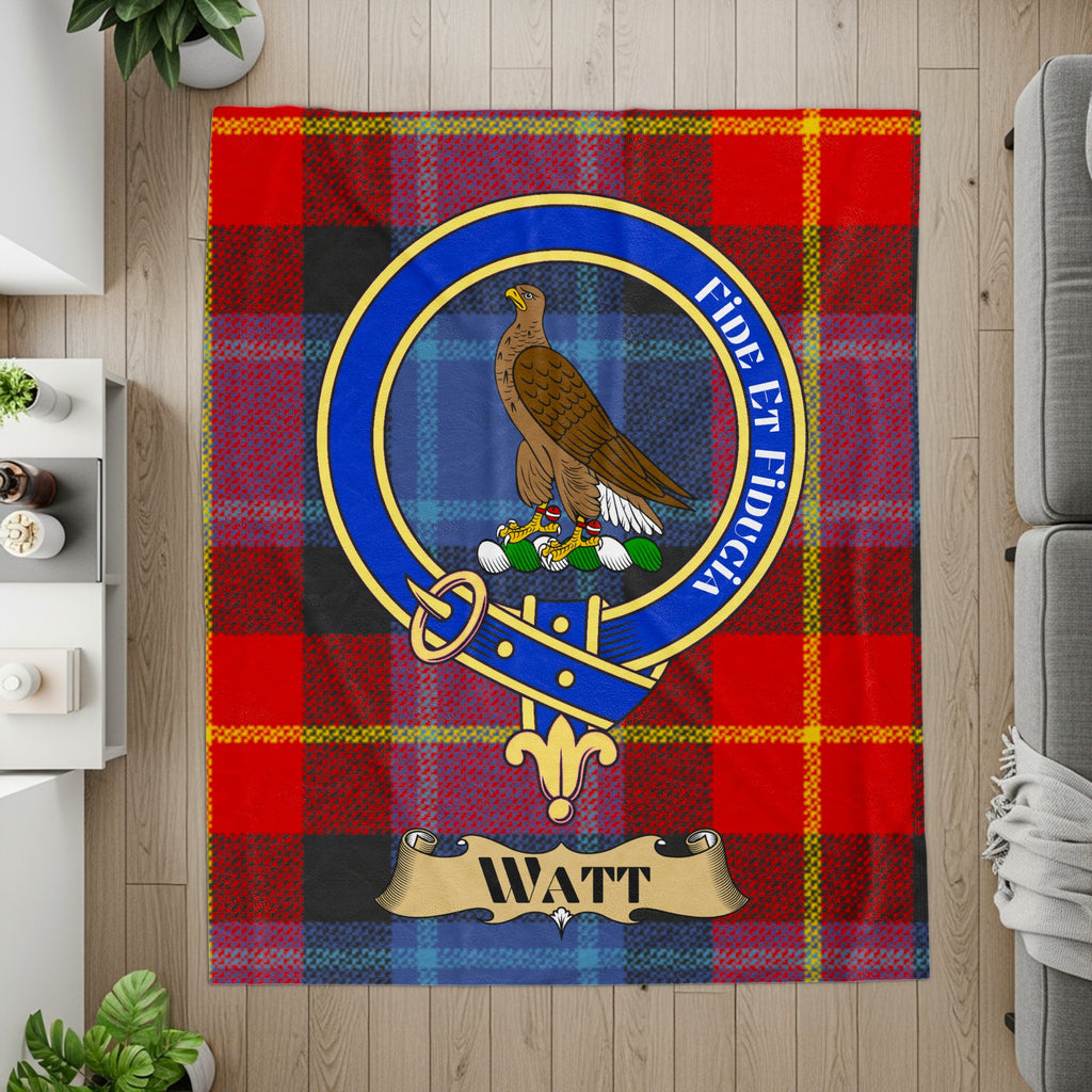 Watt crest and motto on red tartan printed throw — detail view