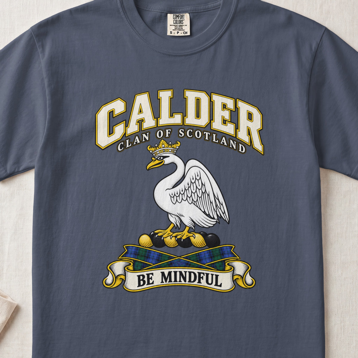Calder Scottish clan T-shirt in Midnight, front view with a white swan wearing a gold crown and motto banner.