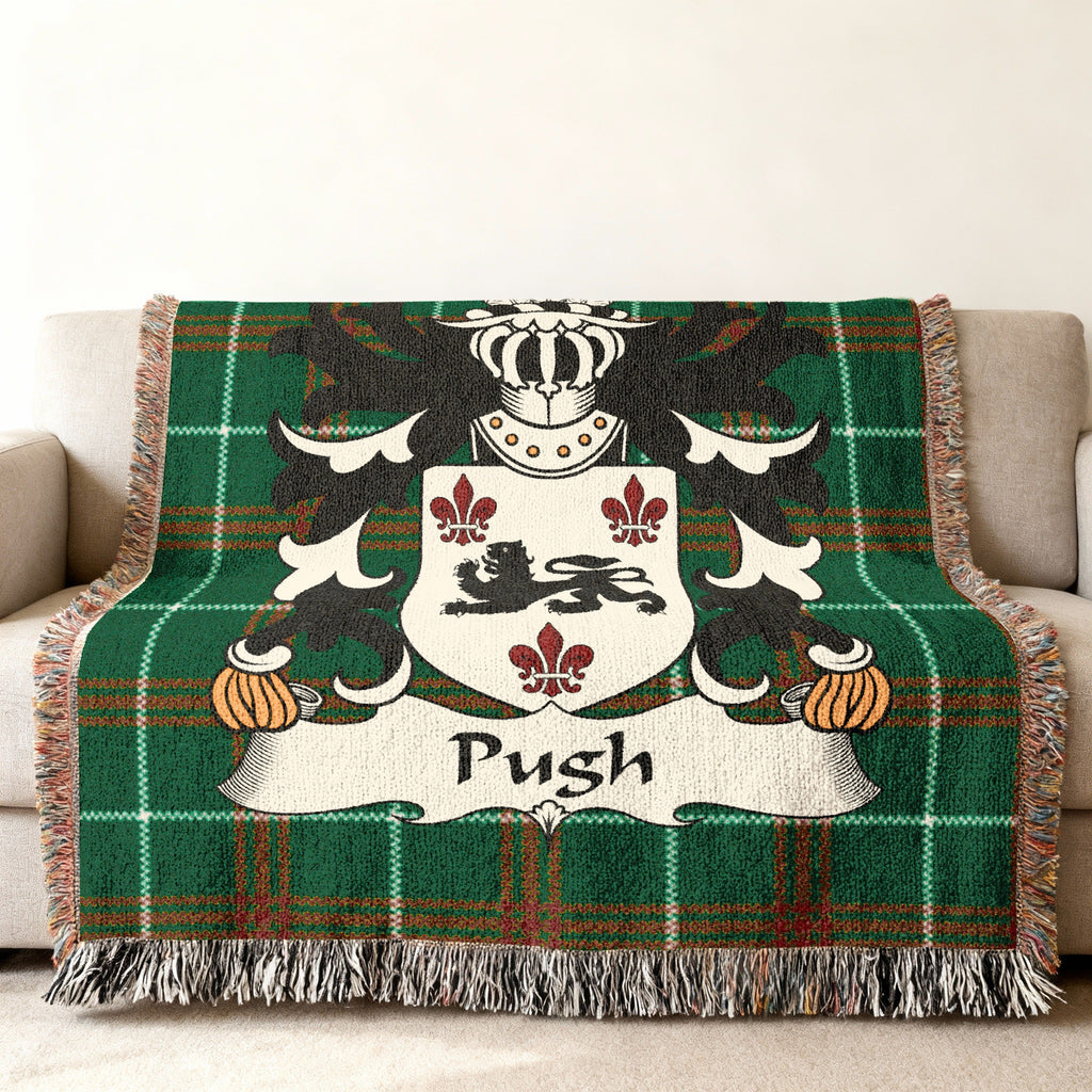 Green tartan blanket with crest featuring a lion and the name "Push".