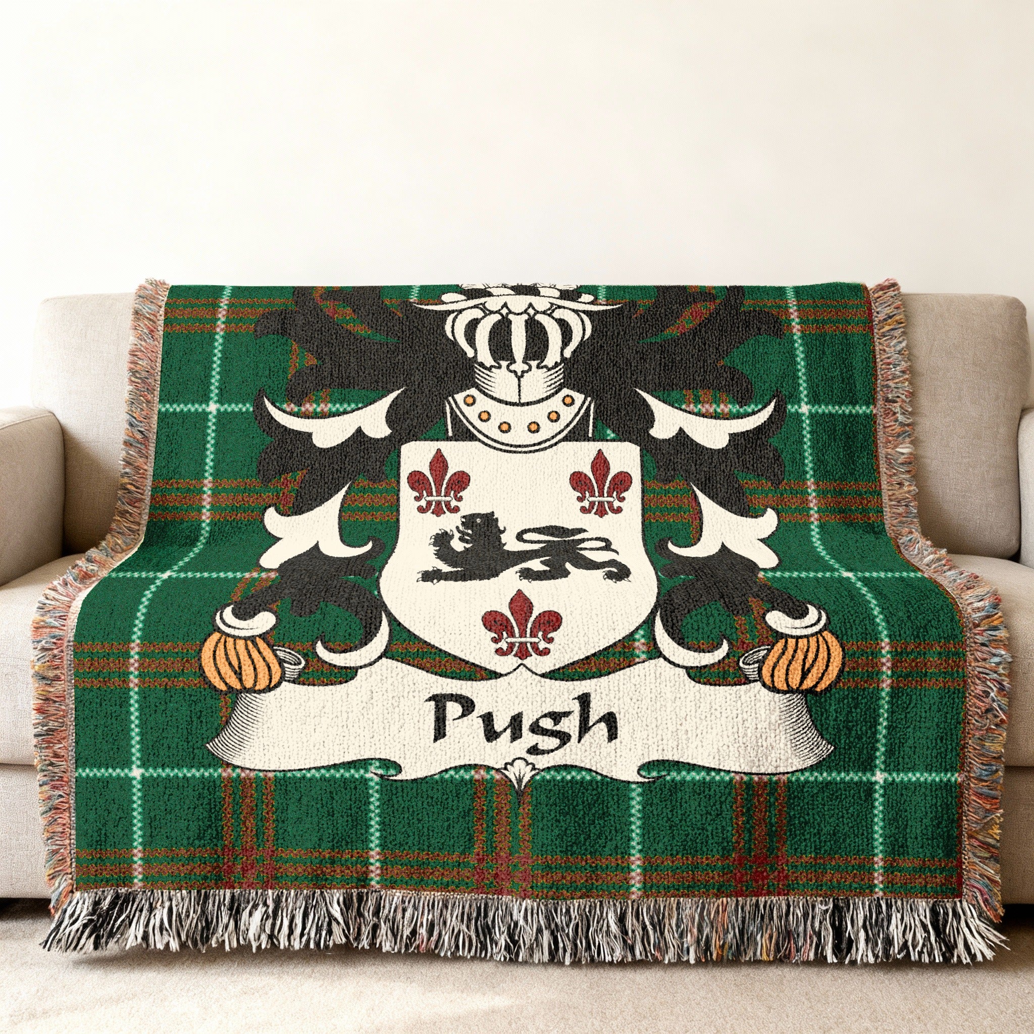 Green tartan blanket with crest featuring a lion and the name "Push".
