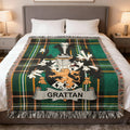 Green tartan blanket with the Grattan family crest.