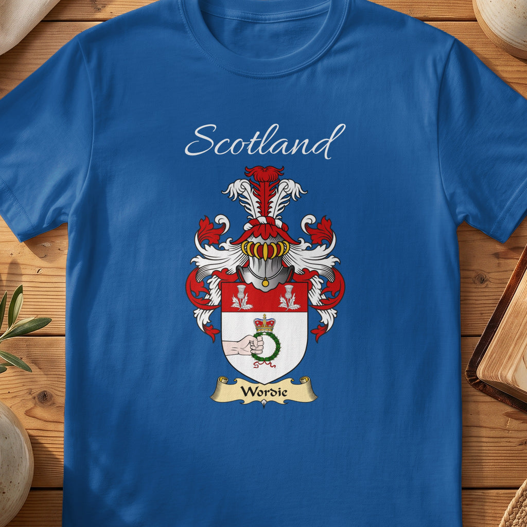 Model wearing the navy Wordie family crest T-shirt featuring “Scotland” and the surname banner.