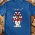 Model wearing the navy Wordie family crest T-shirt featuring “Scotland” and the surname banner.