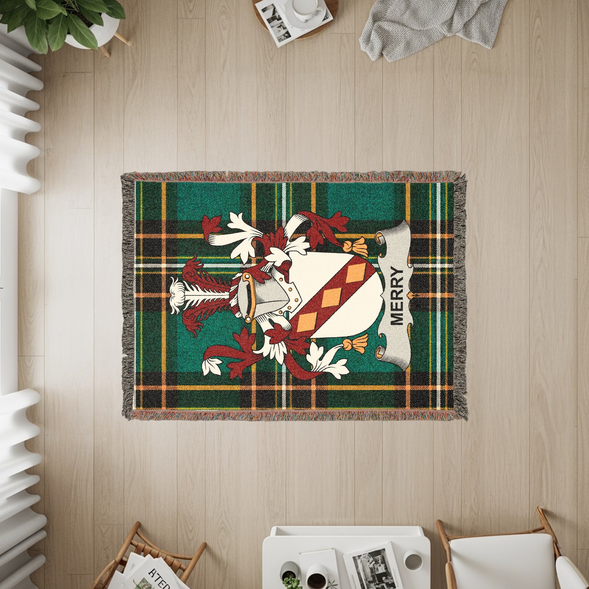 Green plaid blanket with Merry family crest in center.