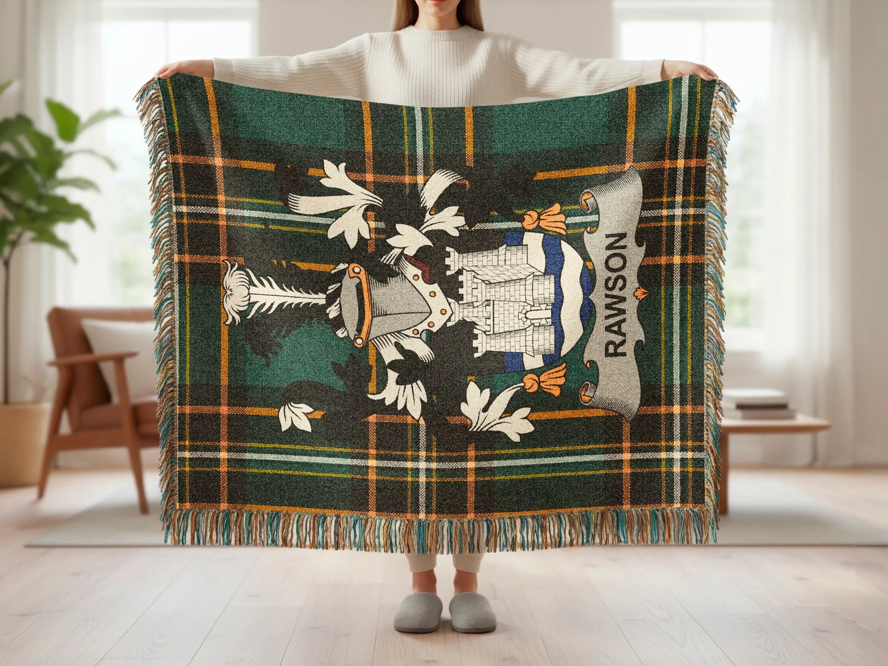 Tartan blanket with white crest and banner reading "RAWSON".