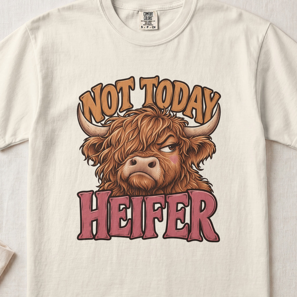 Not Today Heifer Highland cow design on an Ivory Comfort Colors 1717 T-shirt, flat lay