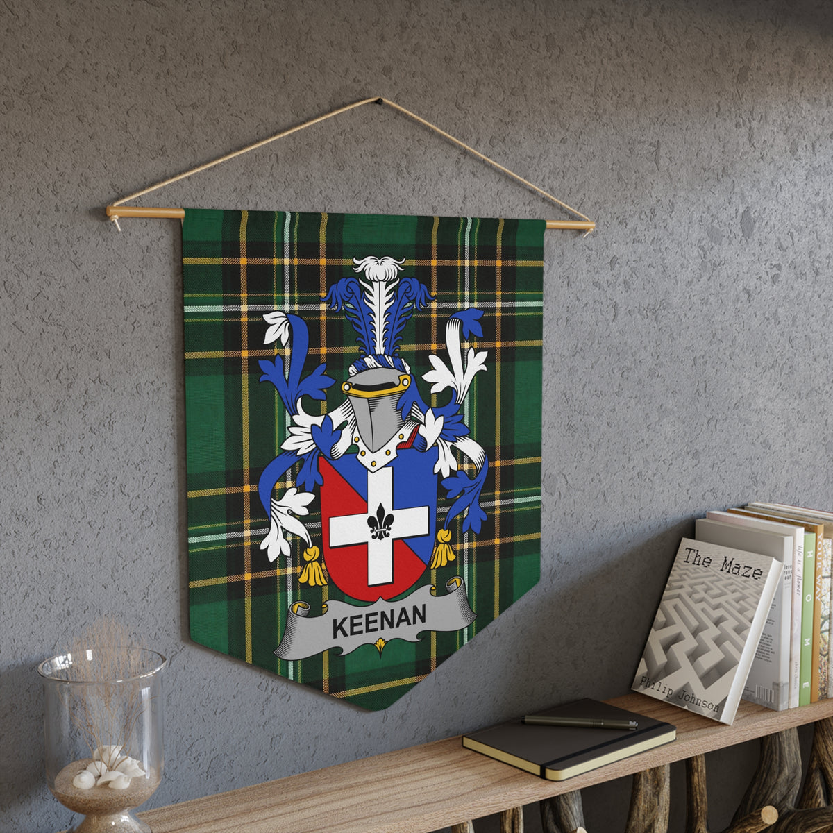Keenan family crest on a green plaid pennant hanging on a wall.