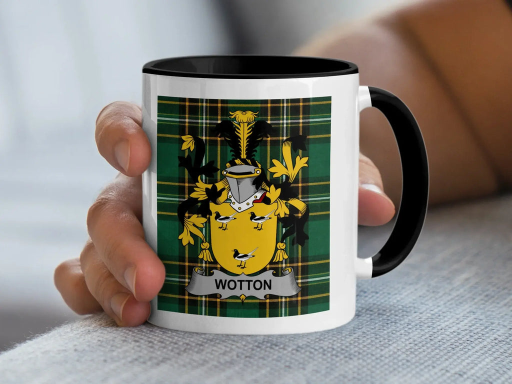 White mug with black rim featuring the Wotton family crest on a tartan background.