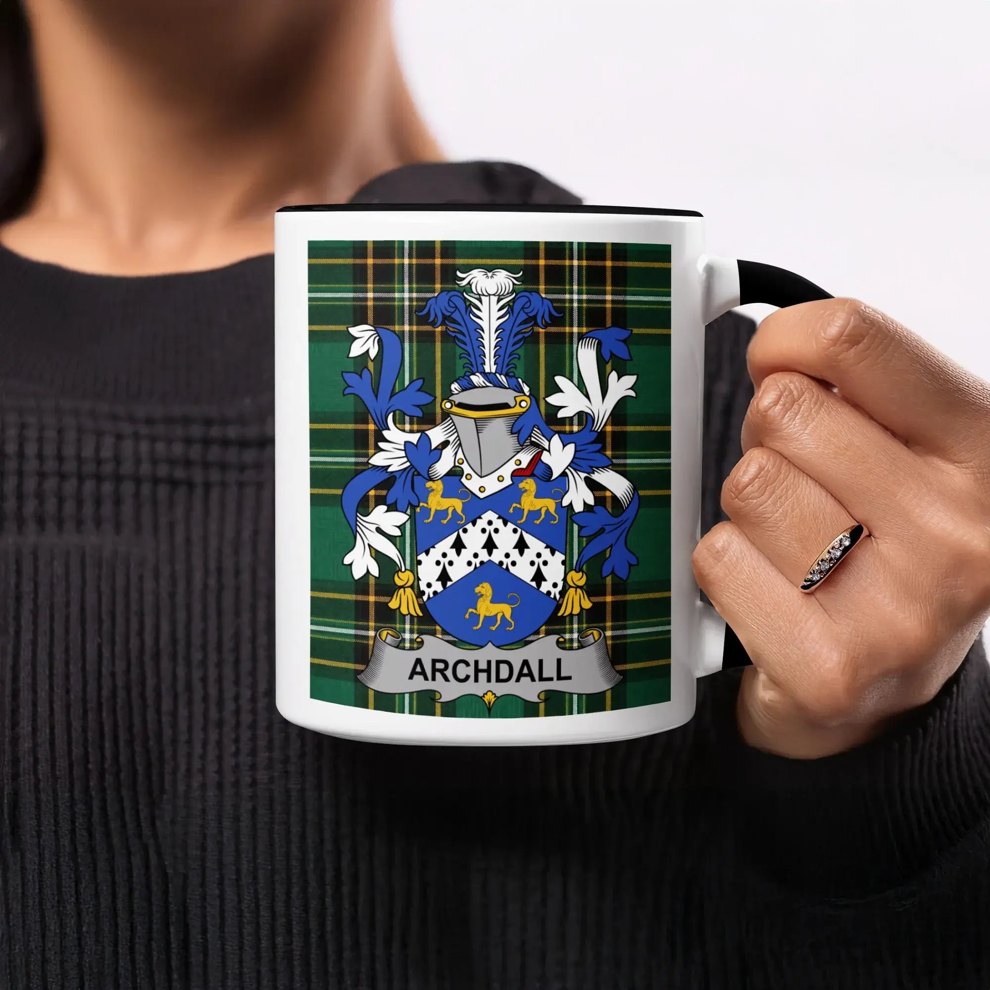 Mug with Archdall family crest on green tartan background.