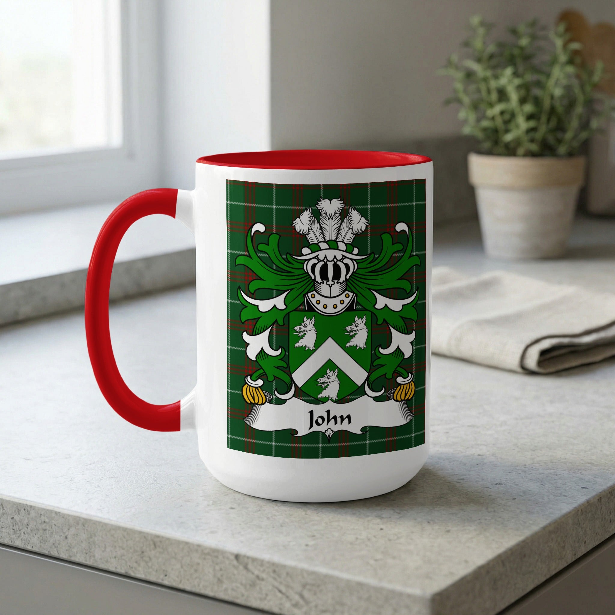 White mug with red handle featuring a green plaid background and a family crest with the name "John".