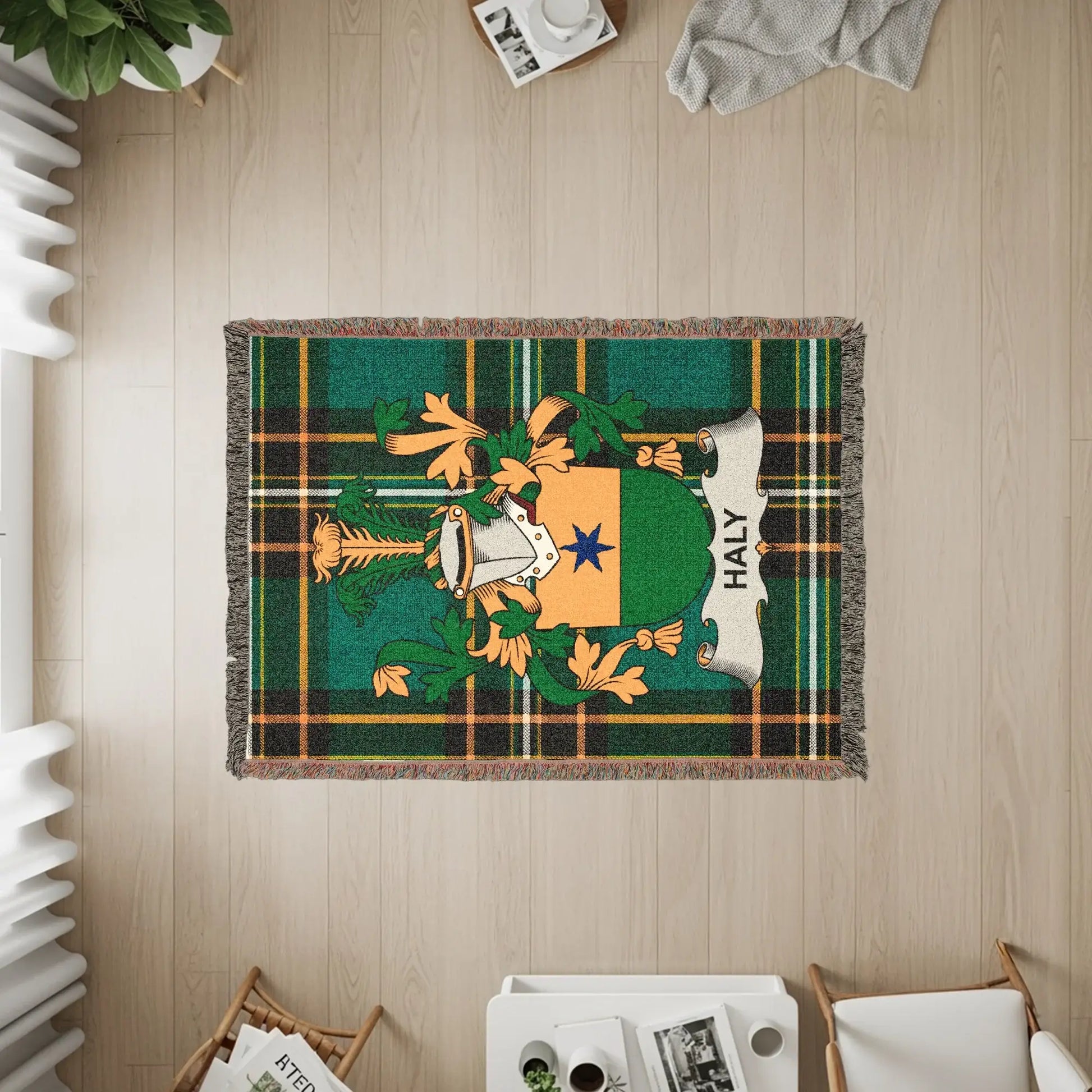 Haly family crest on a green and yellow plaid woven throw blanket.