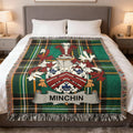 Tartan blanket with the MINCHIN family crest displayed prominently.