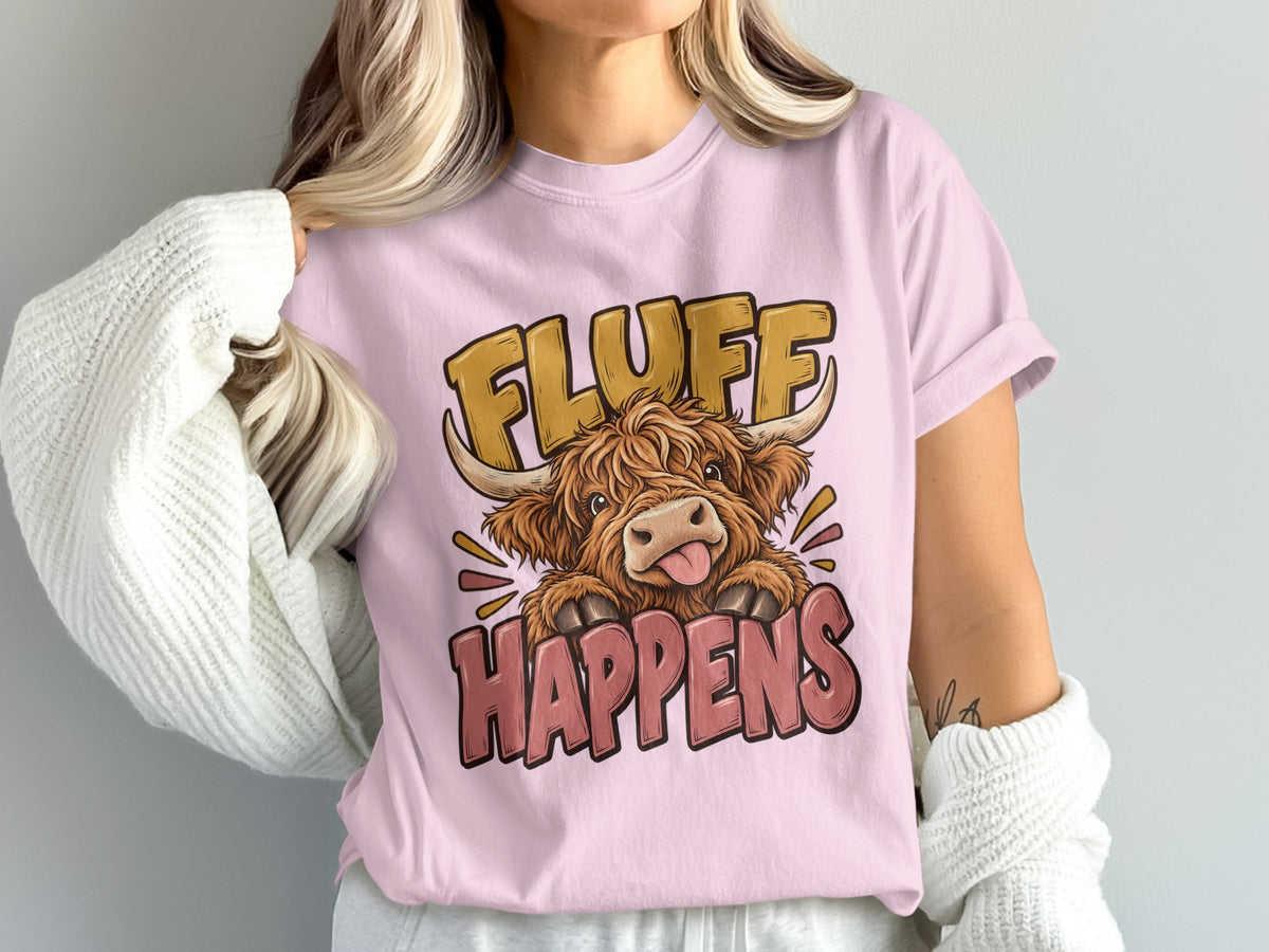 Model wearing the Fluff Happens Highland cow Comfort Colors T-shirt in Blossom