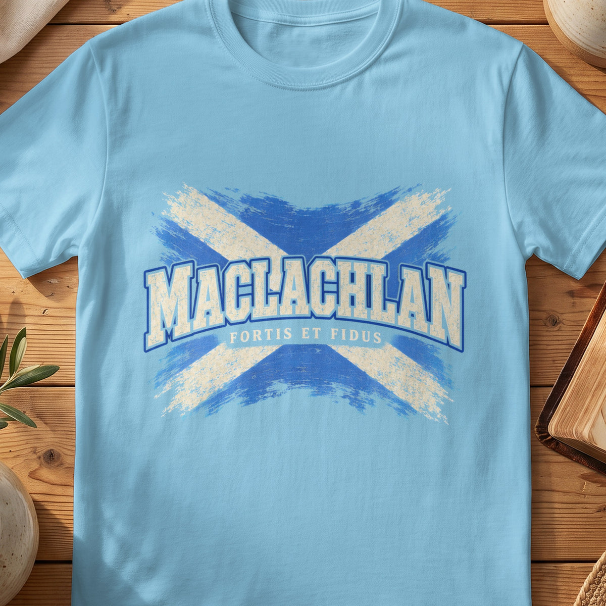 MacLachlan Scottish Saltire T-shirt in Sky, with distressed blue and cream flag and “Fortis et Fidus” lettering.