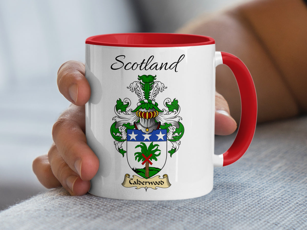 Red-accent Calderwood Scottish surname mug with matching handle and interior and coat of arms artwork beneath “Scotland”.