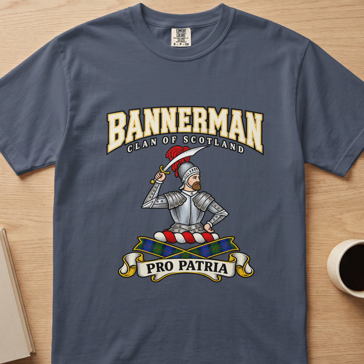 Bannerman armored figure and raised sword graphic on a slate blue Comfort Colors T-shirt, front view