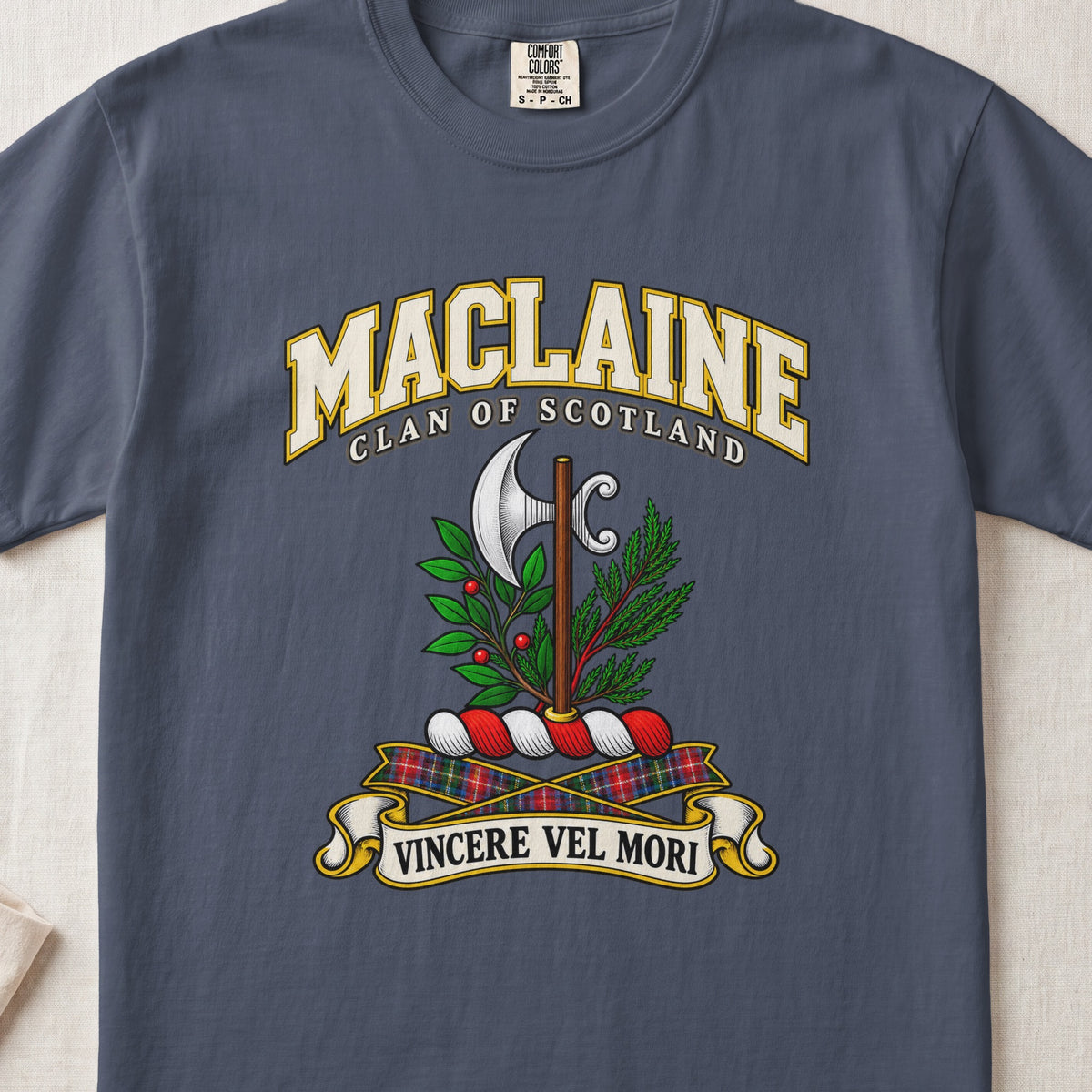 MacLaine Scottish clan T-shirt in Midnight, front view with a silver axe framed by green foliage and motto banner.