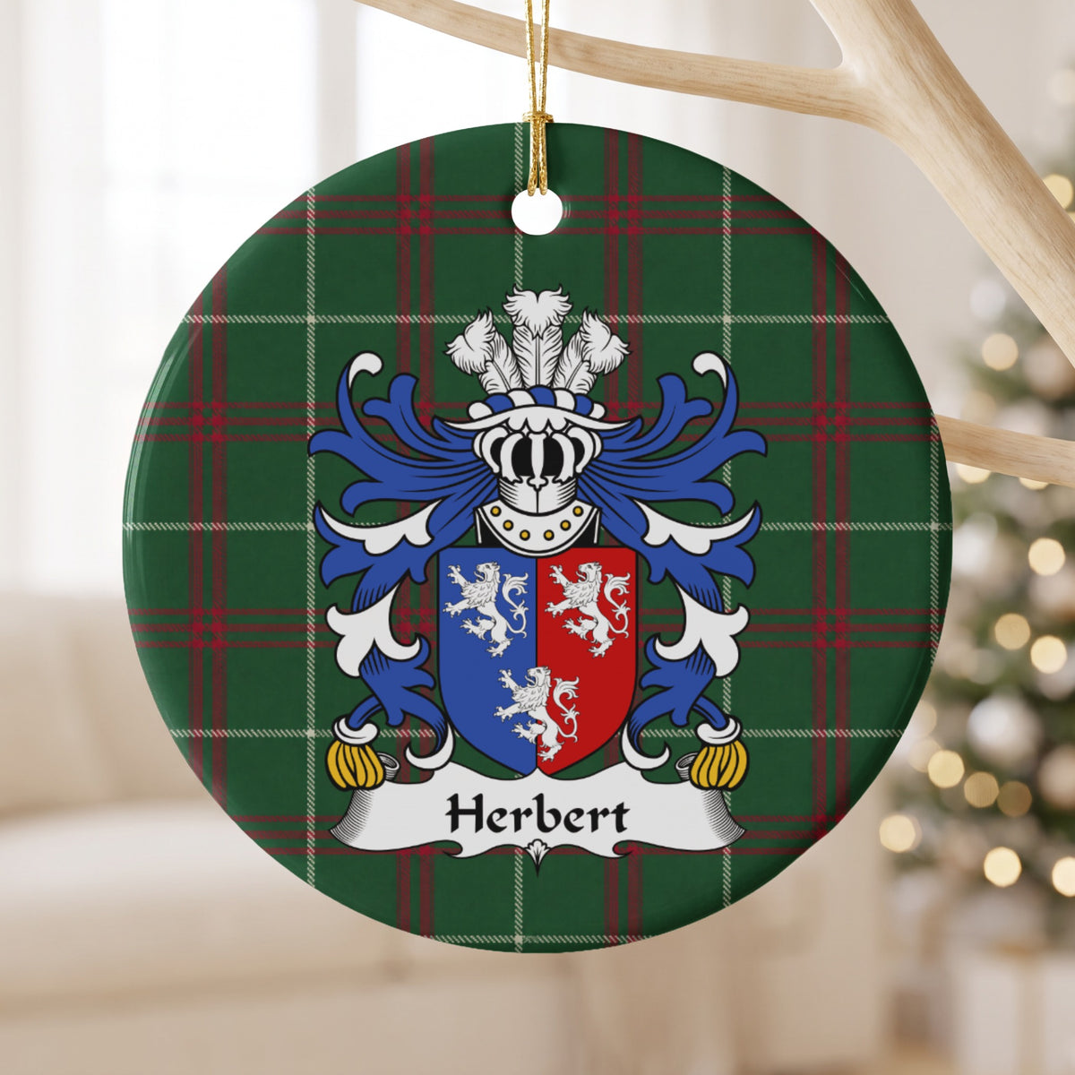 Herbert ornament hanging from a pale wooden branch; three white lions on a vertically divided blue-and-red shield on Welsh national tartan.