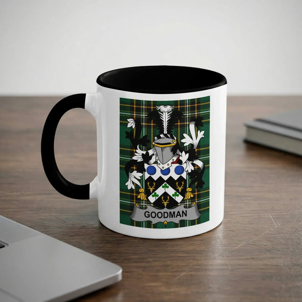 White mug with black handle featuring the Goodman family crest.