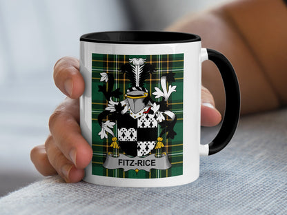 White mug with black rim featuring a Fitz-Rice family crest on a green plaid background.