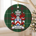 Catchmay ornament hanging from a pale wooden branch; a red chevron bearing three gold horseshoes between three blue lions on a white shield on Welsh national tartan.