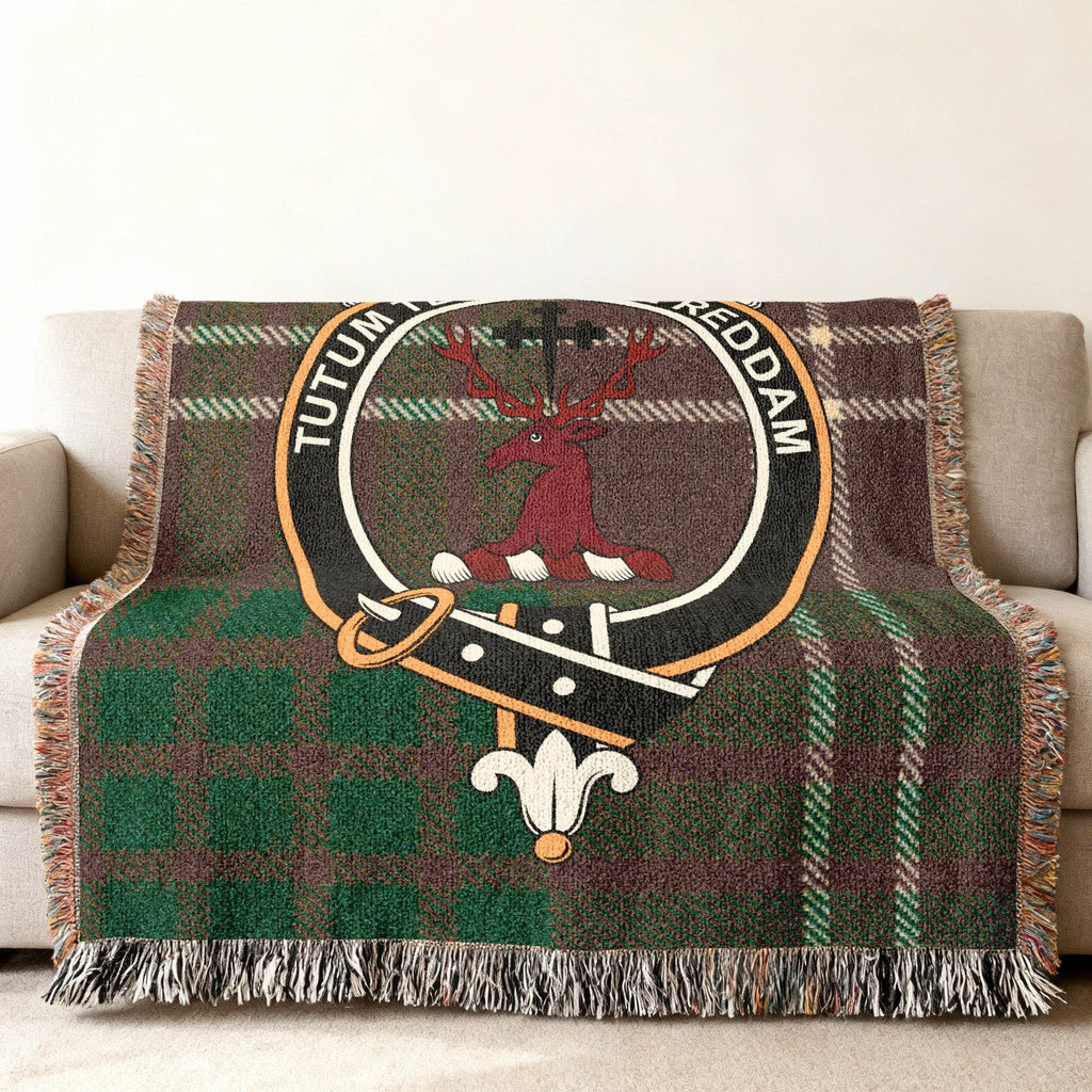 Crawford tartan woven blanket draped — stag crest with Tutum Te Robore Reddam, fringe edges