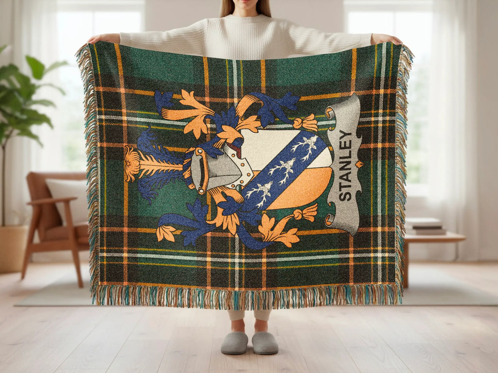 Green plaid blanket with shield emblem and "Stanley" text.