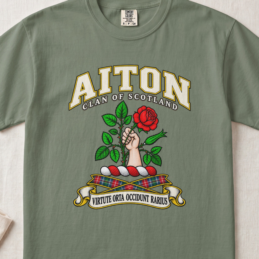 Aiton Scottish clan T-shirt in Moss, front view with a hand holding a red rose with green leaves and motto design.