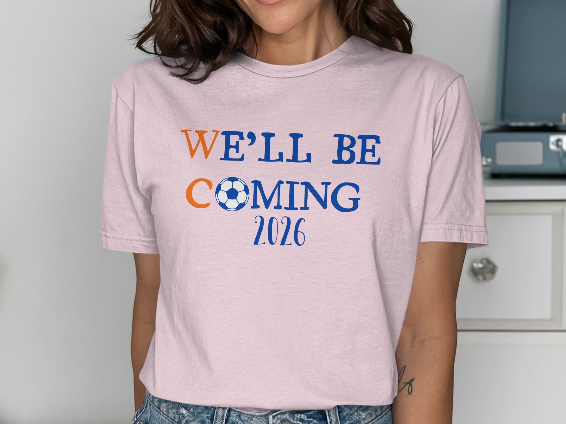 We'll Be Coming 2026 Soccer Fan Pink T-Shirt