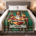 Green plaid throw blanket with a family crest featuring the name "HICKS".