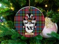 Murdoch Scottish clan ceramic ornament with family crest on a Caledonia tartan background, hanging on a Christmas tree