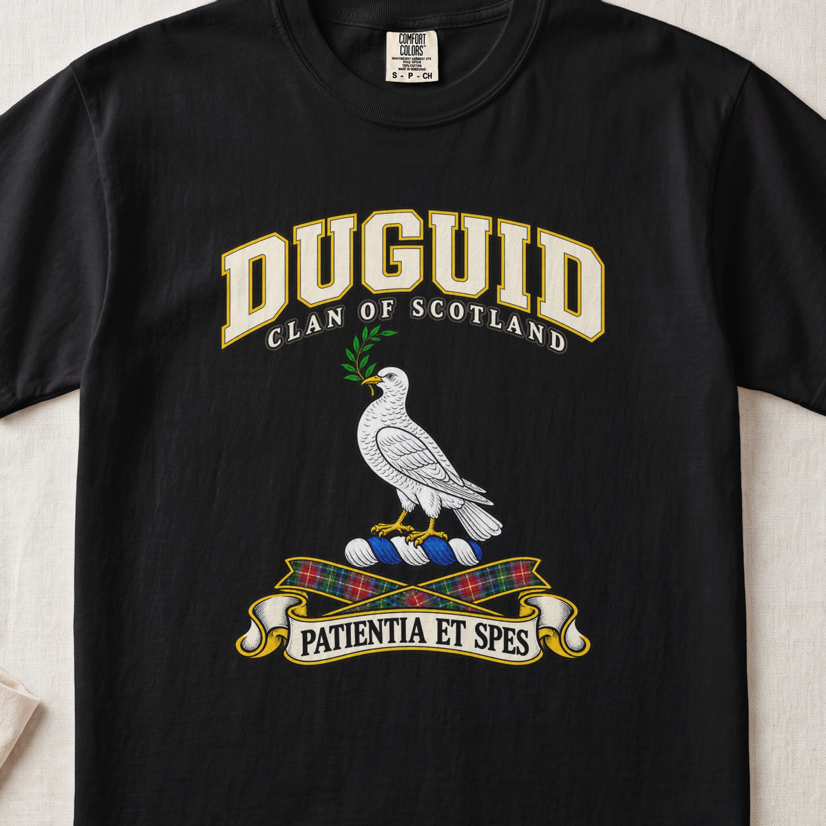 Duguid Scottish clan T-shirt in Black, front view with a white dove holding a green branch and motto design.