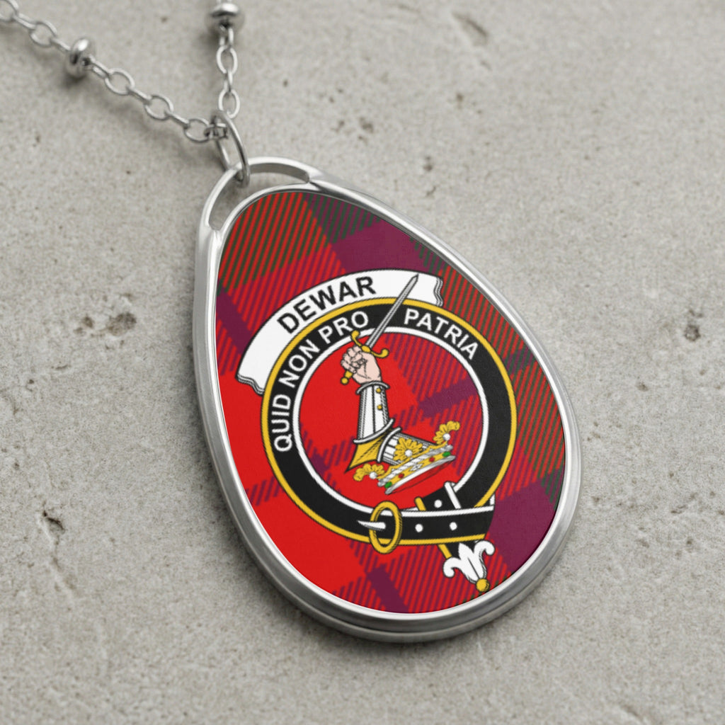 Dewar clan Scottish tartan necklace with clan crest on tartan background