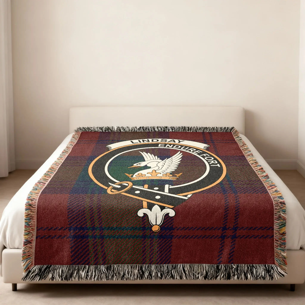 Lindsay Endure Fort tartan woven blanket — clan crest at centre, fringe edge visible