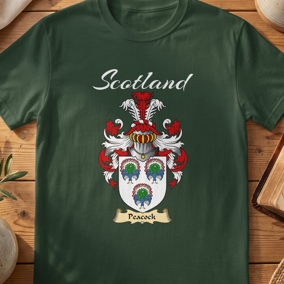 Forest Green Peacock Scottish T-shirt featuring three colourful peacock motifs on a pale shield