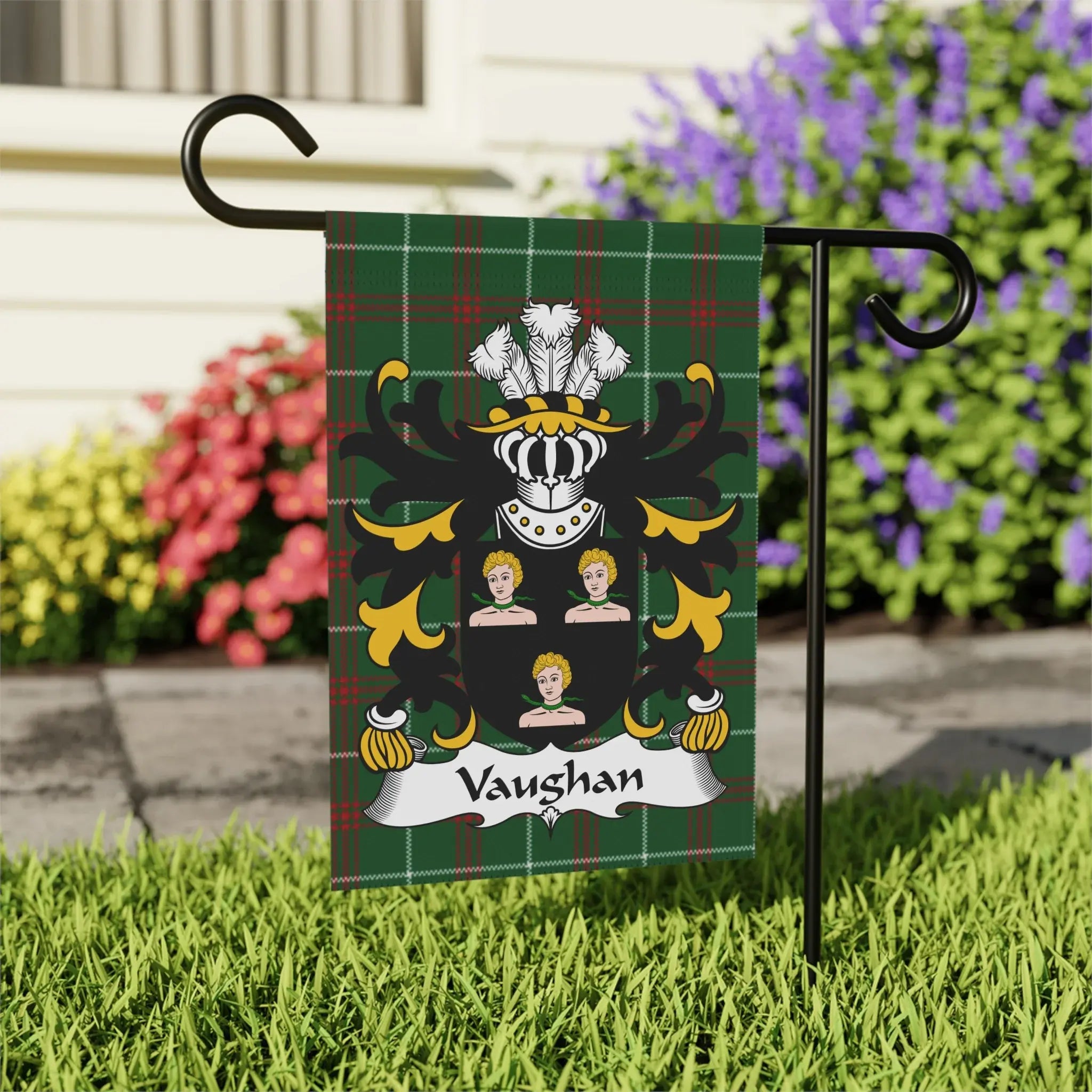 Vaughan family crest on green tartan garden flag with white border.
