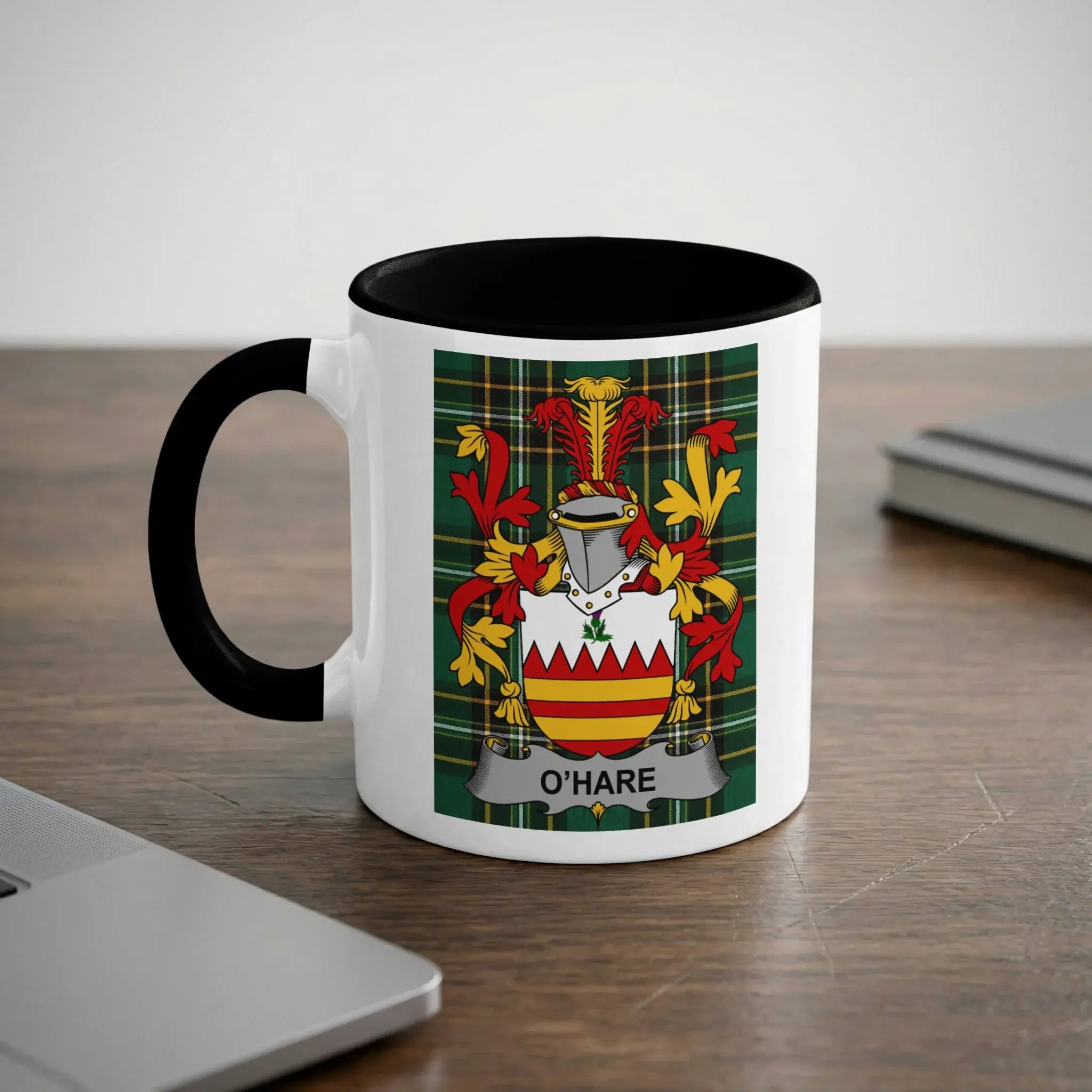 White mug with black handle featuring O'Hare family crest and checkered pattern.