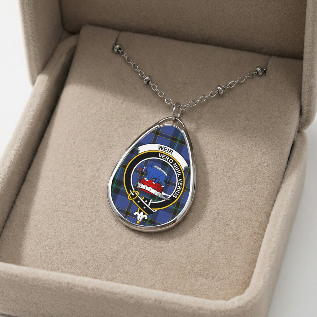 Oval pendant necklace with Weir clan crest on blue tartan background.