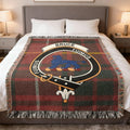 Bruce clan tartan woven blanket on sofa — 100% cotton with red-yellow plaid and clan crest