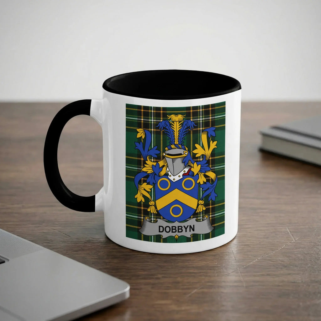 White mug with black rim featuring the Dobbyn family crest on a plaid background.