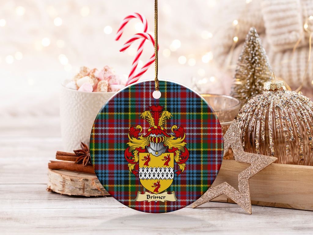 Brimer family emblem ceramic Christmas ornament with Caledonia tartan background in festive holiday décor