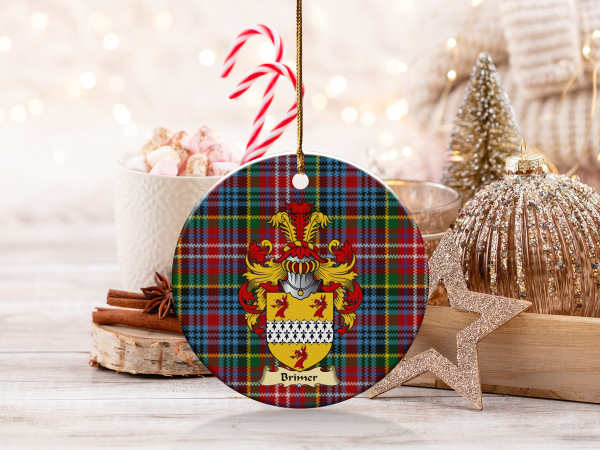 Brimer family emblem ceramic Christmas ornament with Caledonia tartan background in festive holiday décor