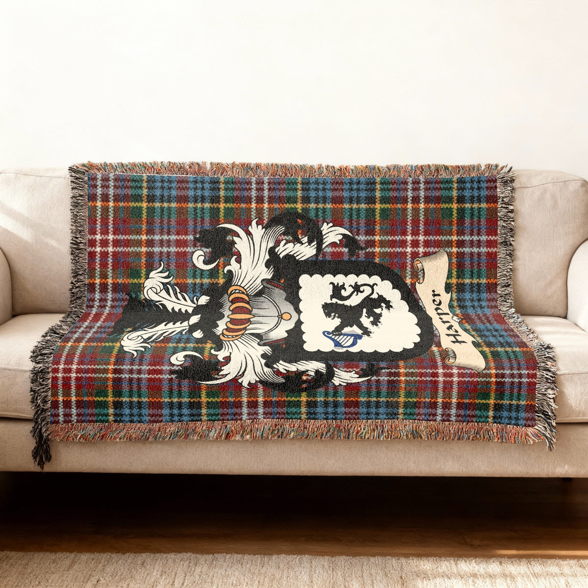 Harper Scottish woven blanket with family shield and Caledonia tartan background